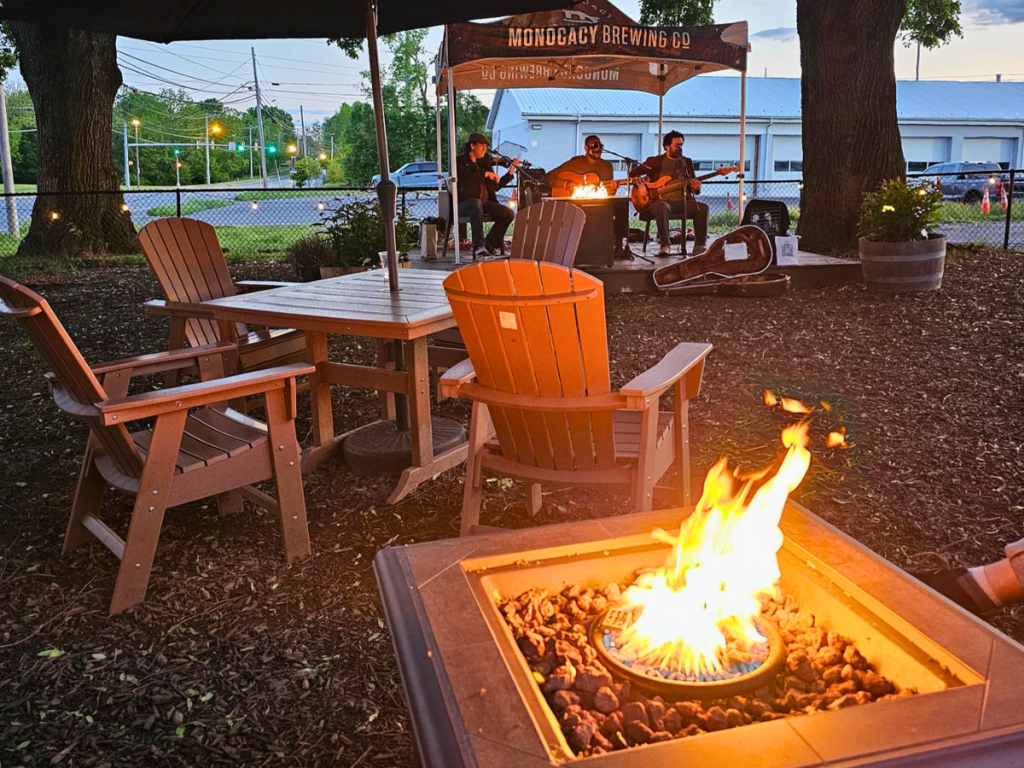 Outdoor brewery seating, fire pit and summer nightlife in Frederick, Maryland