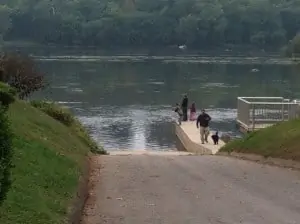 Boys fishing on the boat ramp at Brunswick Family Campground