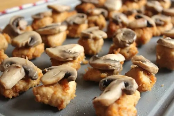 Place mushrooms on top of Chik Fil A nuggets