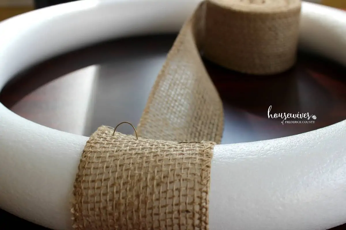 Attaching burlap ribbon to foam wreath form