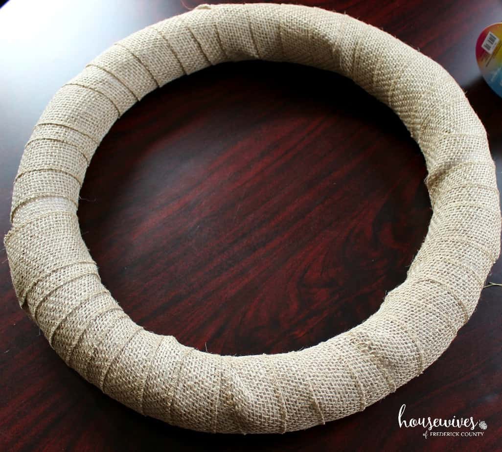 Burlap ribbon wrapped around foam form for front door wreath