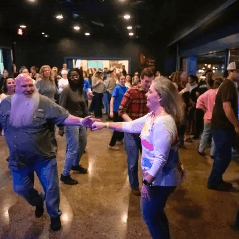 Couple line dancing during a fun date night in Frederick MD