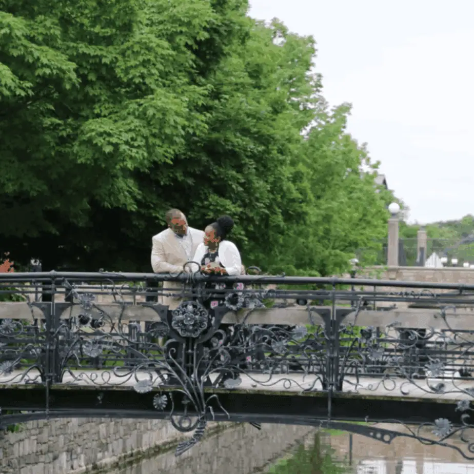 Couple walking along Carroll Creek during a date in Downtown Frederick MD