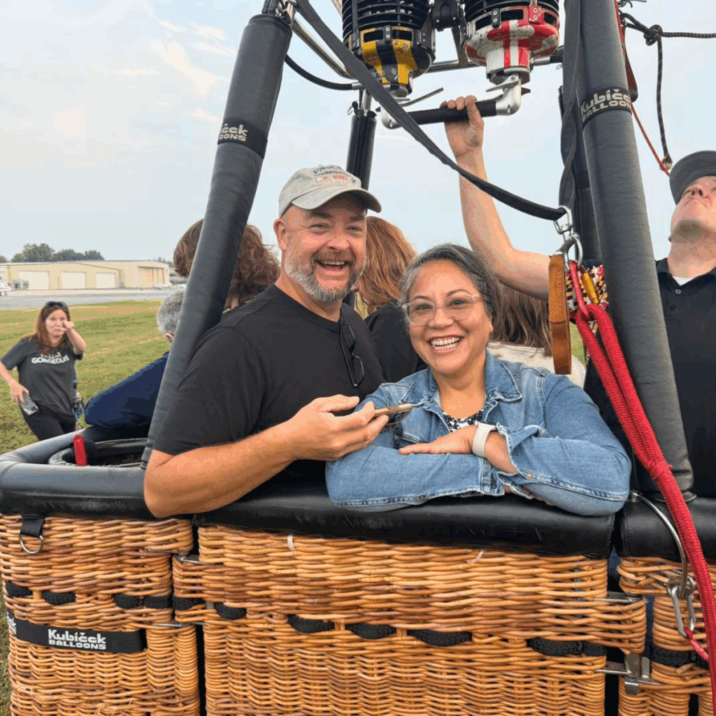 A happy couple getting ready to take off in a hot air balloon in Frederick MD