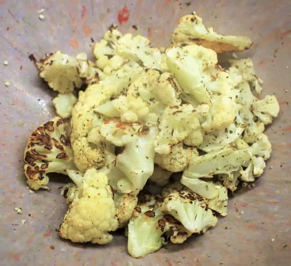 Toss cauliflower steaks with vinegar and cheese