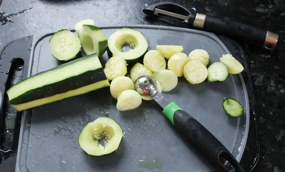 Use a melon baller to create cucumber cups