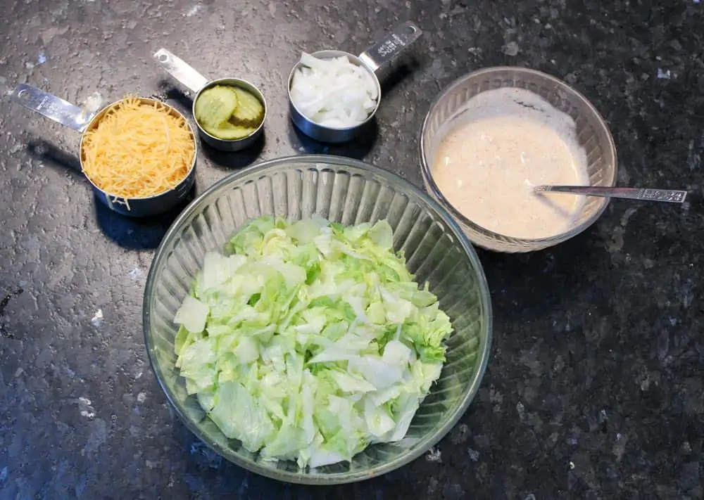 Separate salad ingredients into separate bowls