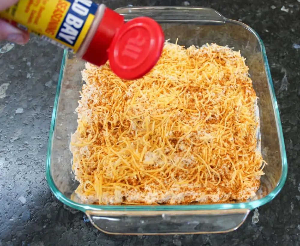 Spread shredded cheddar cheese and Old Bay Seasoning