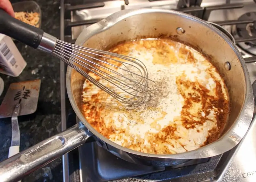 Whisk heavy cream into brandy sauce