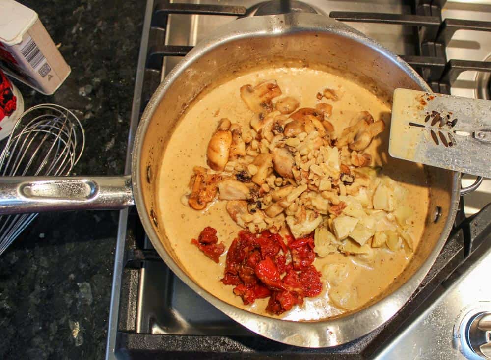 Add mushrooms, sun-dried tomatoes, artichoke hearts, & walnuts