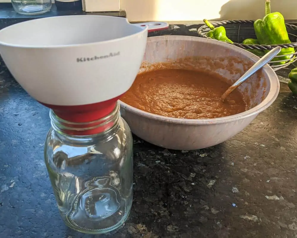 Use a kitchen funnel to transfer to a container