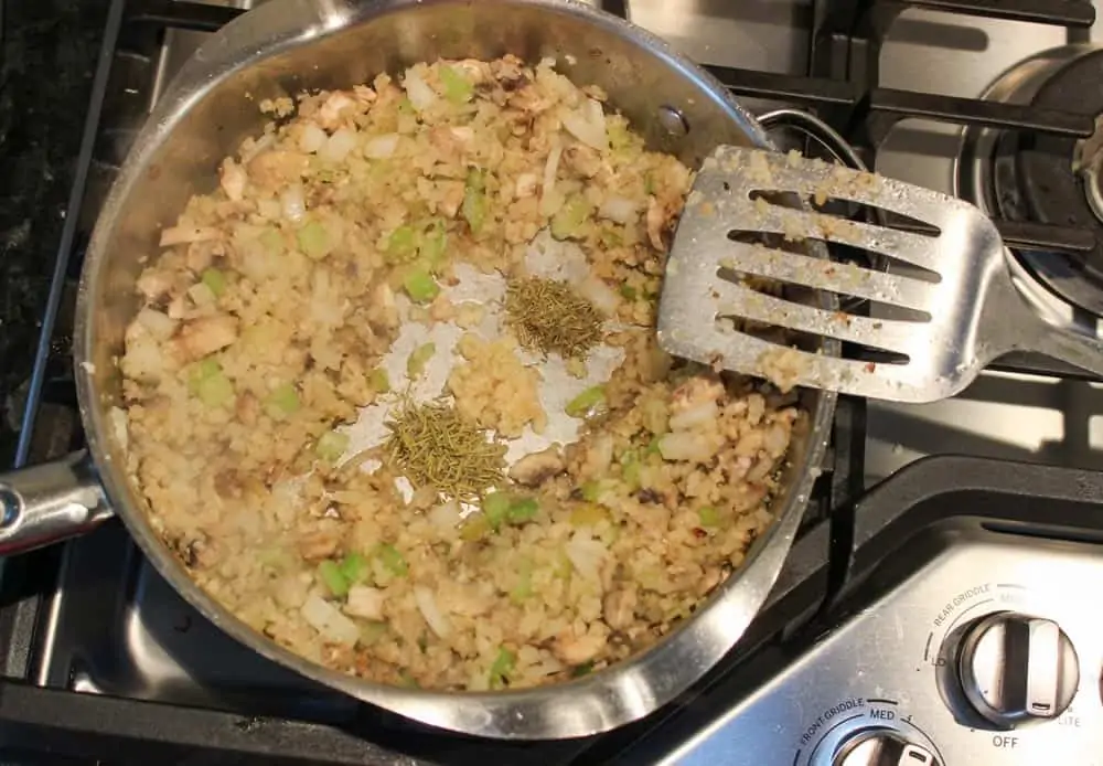 add garlic and herbs to cauliflower rice
