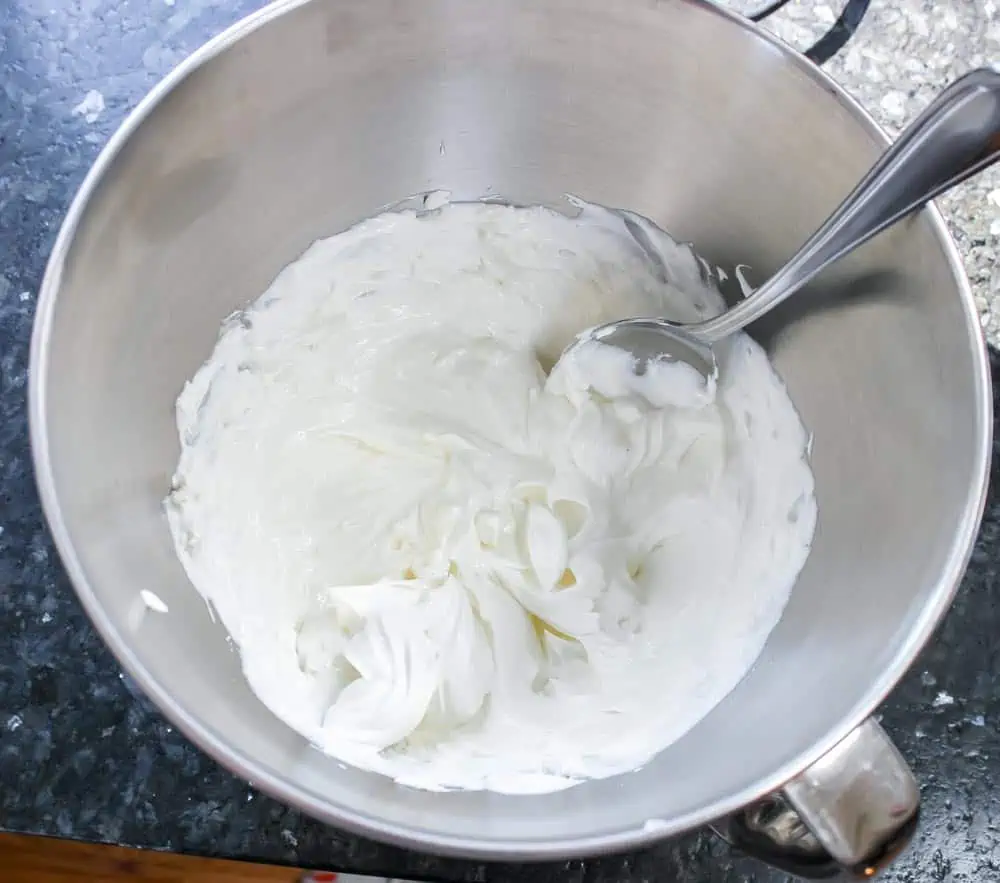 Mix cream cheese and sour cream