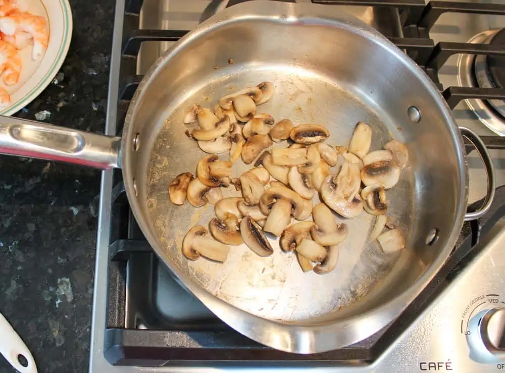 Saute mushrooms in skillet