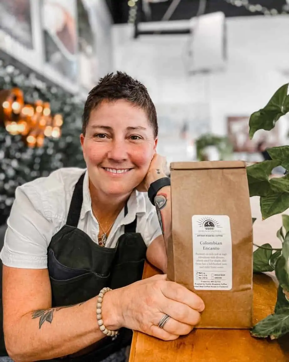 Dublin Roasters Owner Serina Roy holding bag of coffee