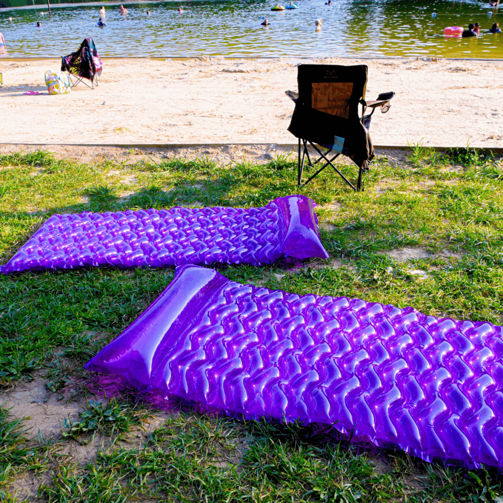 Cunningham Falls State Park, sandy beach with rafts and kids swimming in Hunting Creek Lake
