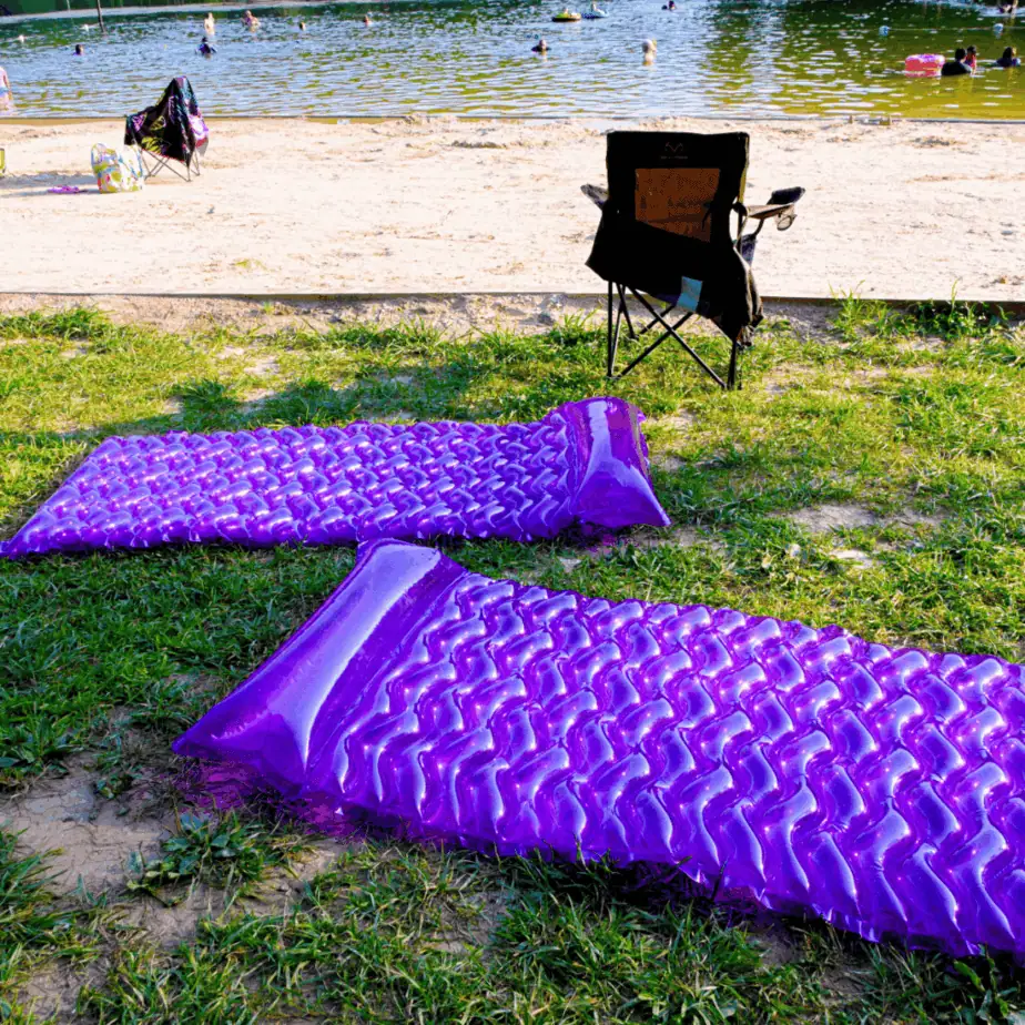 Cunningham Falls State Park, sandy beach with rafts and kids swimming in Hunting Creek Lake