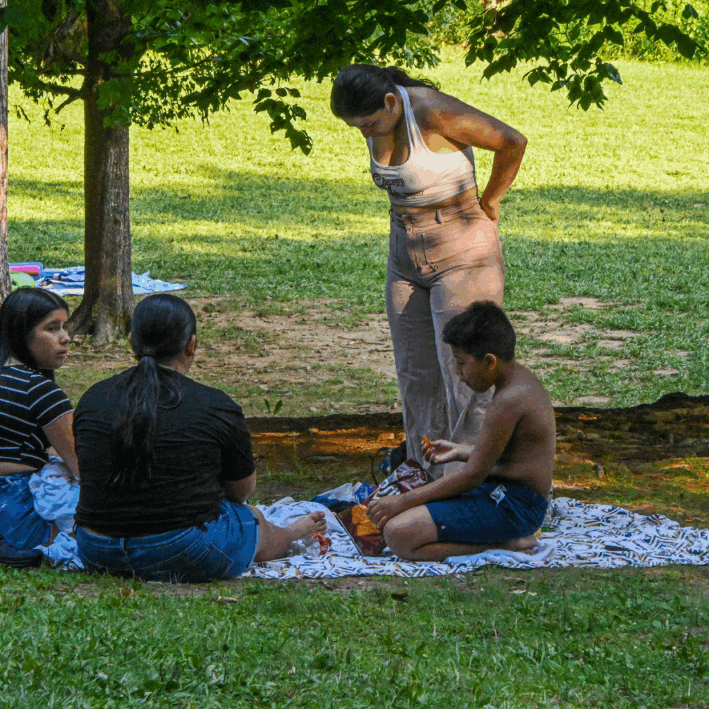Cunningham State Park Hunting Creek Lake - Family having a picnic on a blanket in a shady area 