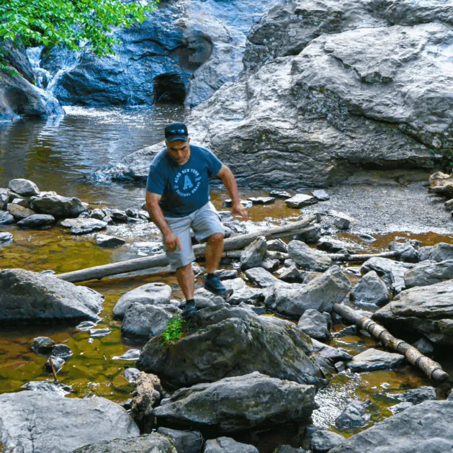 Cunningham Falls State Park Man walking at base of waterfalls