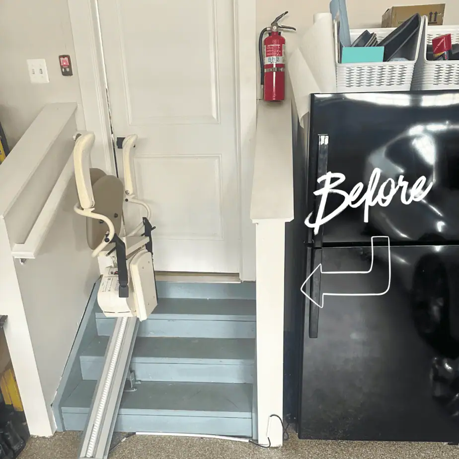 Temporary stair lift installed on garage steps as a short-term accessibility solution before a permanent vertical platform lift installation